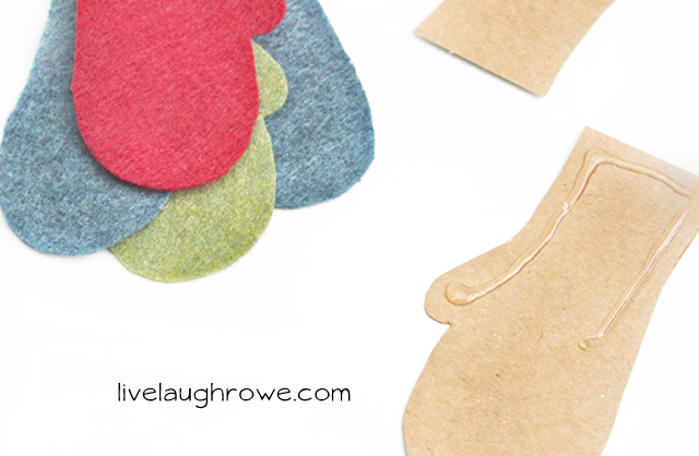 place glue on cardboard cut out and attach felt mitten